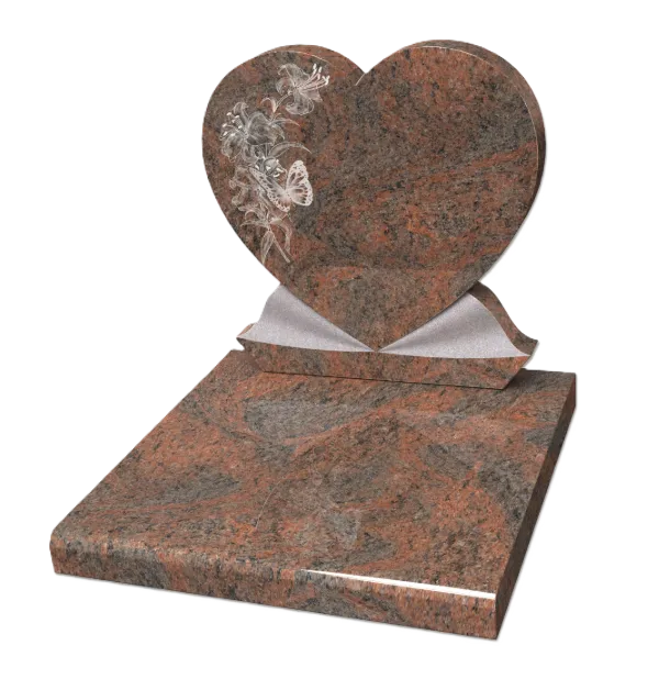 Monument funéraire en granite rose avec stèle en forme de cœur gravée d'un motif floral